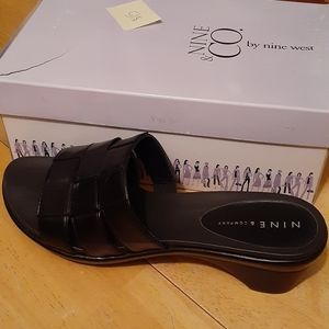 Black leather slides